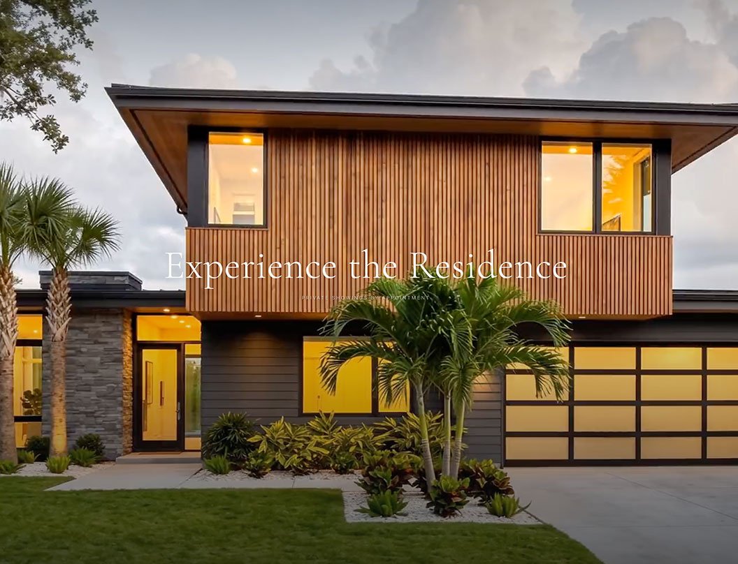 Luxury coastal home rendered at dusk with palms and circular drive